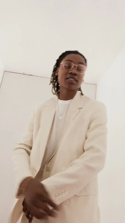 Vertical Portrait of Stylish Young Black Man Dancing and Gesturing to Camera Stock Footage 337405113