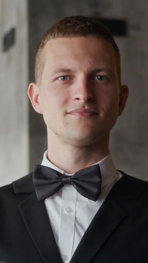 Vertical Portrait of Waiter in Uniform Checking Menu in Restaurant Stock Footage 312662872