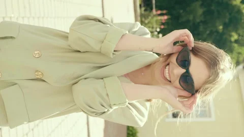 Vertical portrait of young beautiful smiling hipster girl Stock Footage 142623633