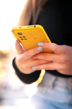 Vertical portrait young boy using smartphone app outdoors. Stock Photos