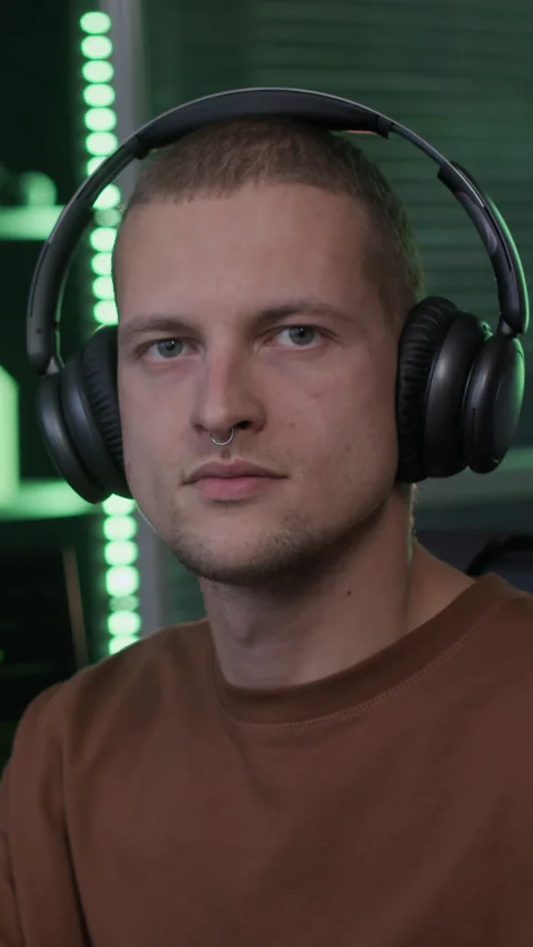 Vertical Portrait of Young Male Programmer at Computer Desk in Office at Night Stock Footage 292901864