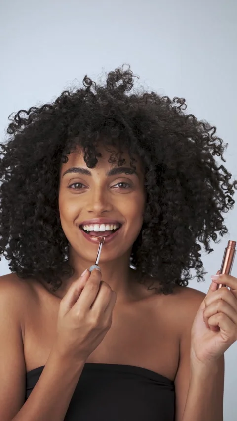 Vertical portrait of a young model with dreary afro hair and bright makeup Stock Footage 315289620