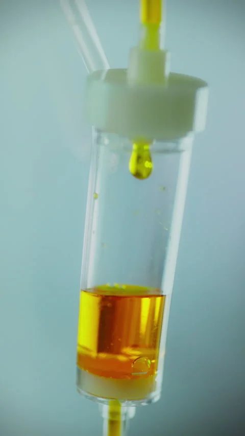 Vertical position. Dropper for intravenous infusion. The bright liquid medic Stock Footage 281736740
