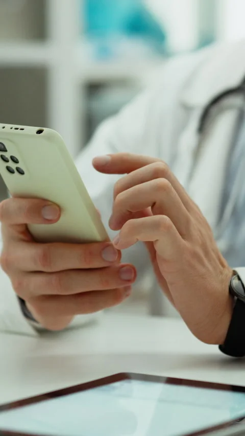 Vertical position. Health care system. A doctor in uniform works with a mode Stock Footage 331736202