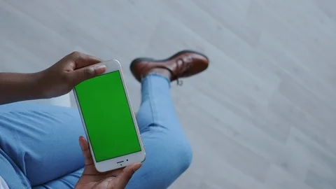 Vertical position shoot. Green Screen or Mock-up Tracking on smartphone. Dark Stock Footage 121100513