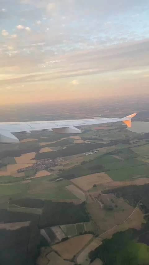 Vertical POV Airplane Window Turning Over Munich Landscape Sunset - Jul 10 2026 Stock Footage 339688264