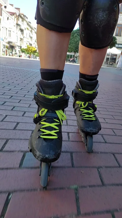 Vertical POV facing backward inline skating red brick tiles ASMR sound 4K UHD Vídeos de archivo 344930411
