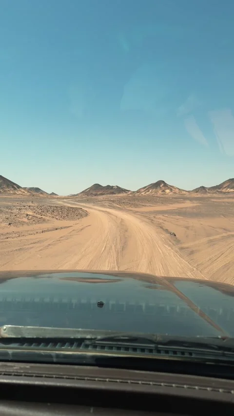 Vertical POV through windshield driving off road on sandy desert track Stock Footage 340867397