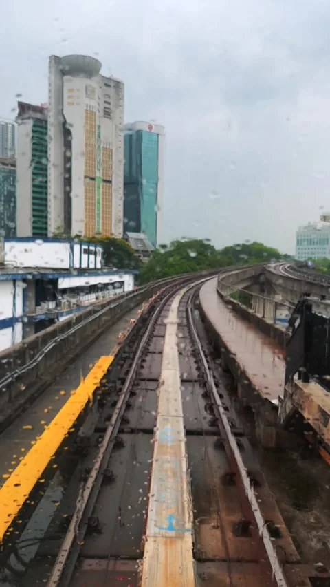 Vertical pov view from KL Monorail train window moving toward from the Station Stock Footage 341650868