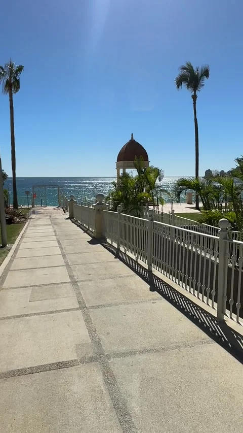 Vertical POV Walking Path Toward Ocean with Kiosk in Los Cabos – Dec 2023 Stock Footage 313849967