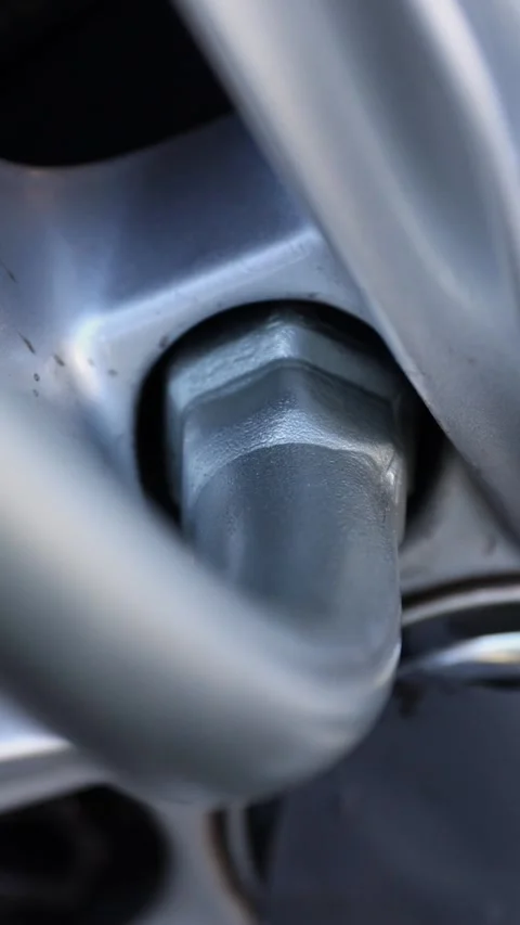 Vertical. Process of tightening nuts during installation of wheel Stock-Footage 324200975