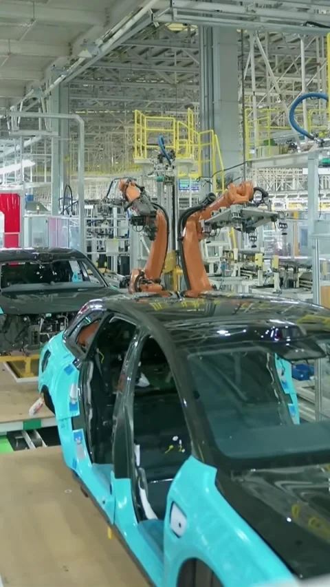 Vertical Production View of Modern Green Car on Automated Assembly Plant Flo Stock Footage 332960406