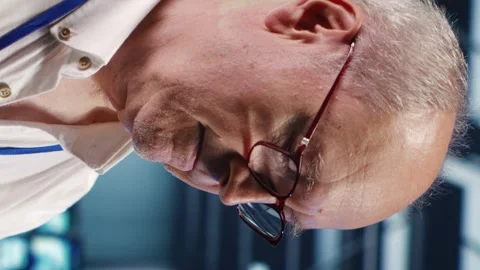 Vertical Professional running code in data center Stock Footage 248420480