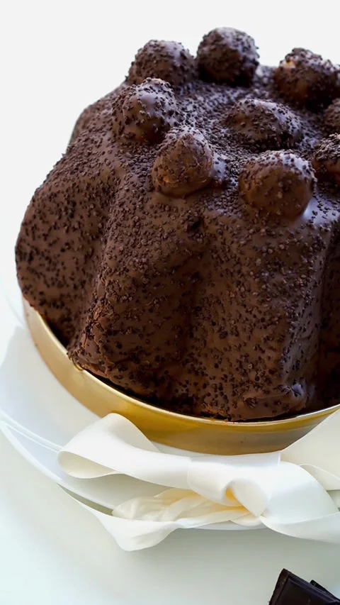 Vertical - Profiteroles Chocolate Cake with White Ribbon, Slow Motion Stock Footage 329929278