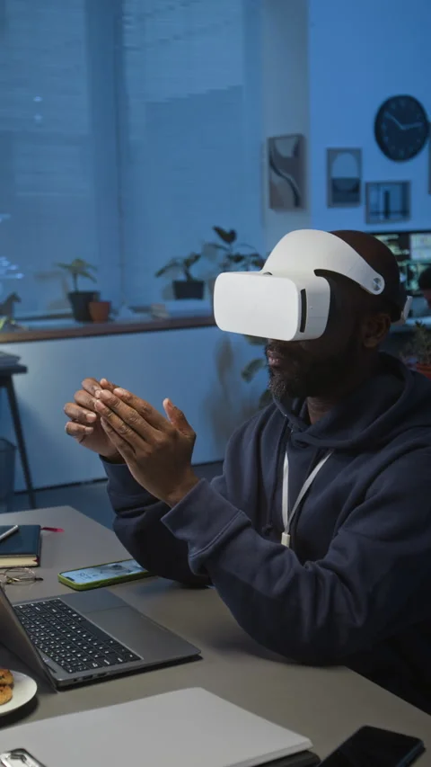 Vertical of Programmer Wearing VR Headset Creating Immersive AR Application Stock Footage 329615177