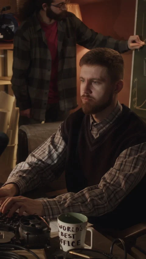 Vertical of Programmer Working on Computer in Office Garage Stock Footage 264247245