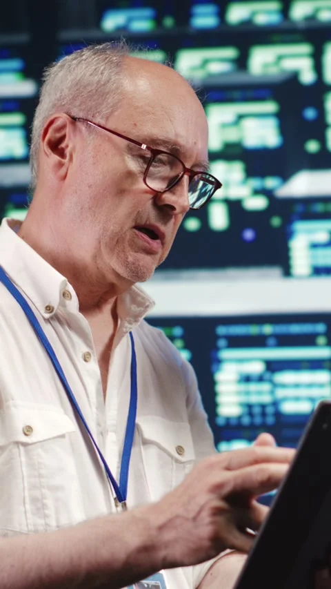 Vertical Programmers running code in data center Stock Footage 247624747