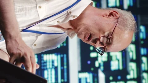 Vertical Programmers running code in data center Stock Footage 247797627