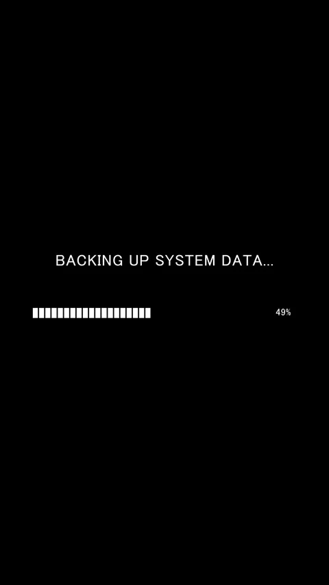 Vertical progress bar with text Backing Up System Data on black background Stock Footage 337937413