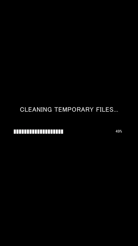 Vertical progress bar with text Cleaning Temporary Files on black background Stock Footage 337937577