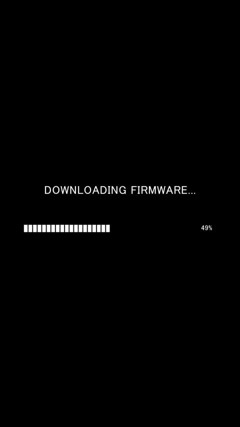 Vertical progress bar with text Downloading Firmware on black background Stock Footage 337936728