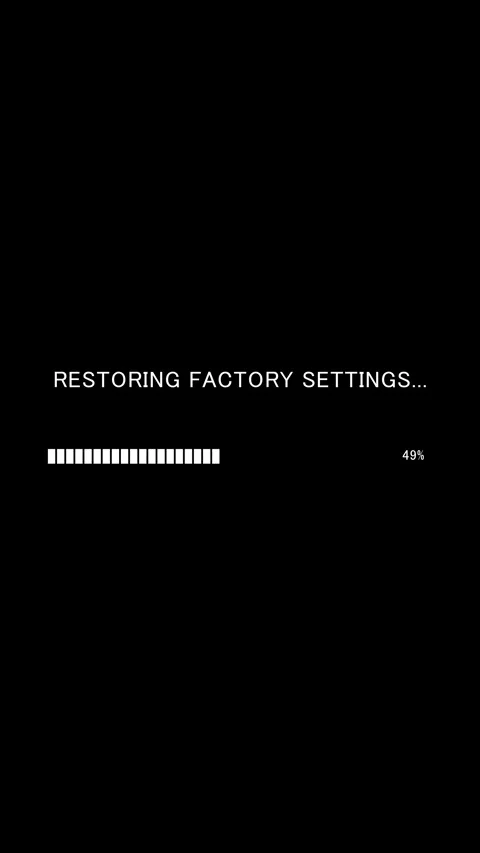 Vertical progress bar with text Restoring Factory Settings on black background Stock Footage 338370624