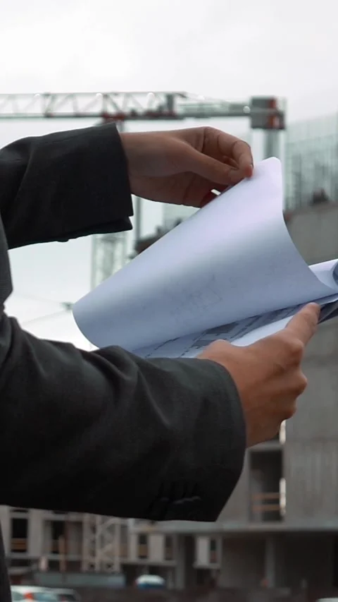 Vertical of Project manager checking construction plan Stock Footage 305497484