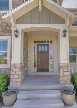 Vertical Puffy clouds at sunset Facade of a house with traditional craftsman Stock Photos