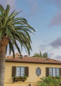 Vertical Puffy clouds at sunset Two houses with mediterranean and traditional Stock Photos