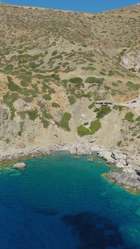 Vertical pullback of Agia Anna beach and turquoise sea, Amorgos Stock Footage 315852859