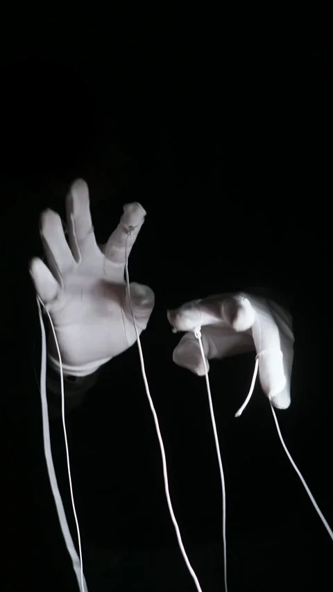 Vertical Puppet Master Hands Manipulation and Power Metaphor 4K Stock Footage 332449293