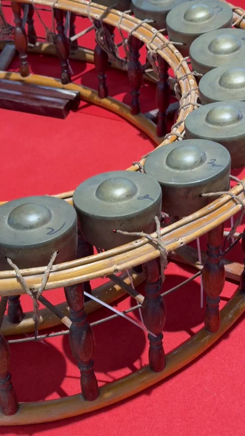 Vertical Rack Focus View Moving From Close To Wide Of Gong Circle Instrument Stock Footage 345710540