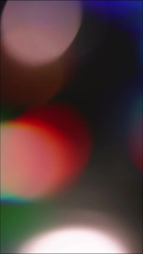 Vertical Rainbow Reflections and Soft Bokeh on Black Background Stock Footage 345360742