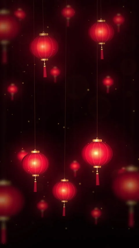 Vertical red paper lanterns with gold caps and tassels swaying in a dark nigh Stock Footage 347680849