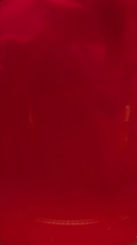 Vertical red splash filling glass ink wave swirl Stock Footage 339769818
