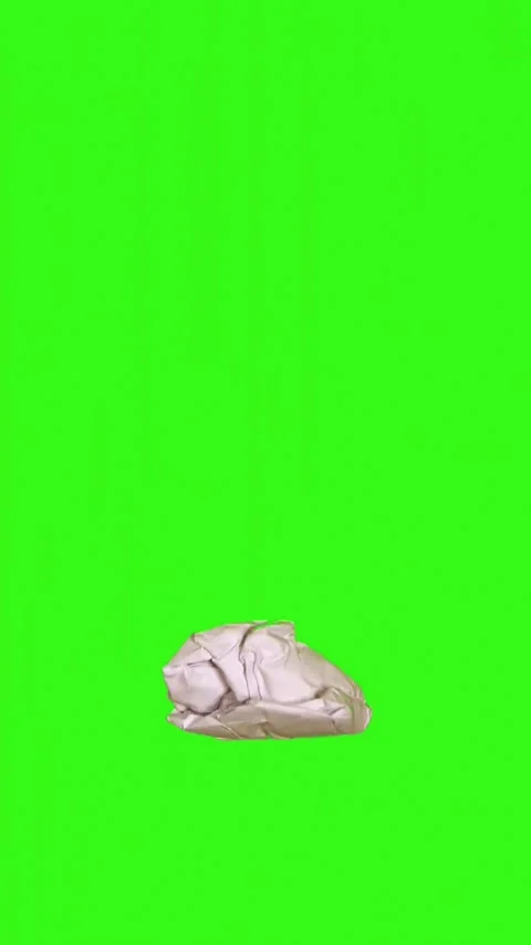 Vertical reel crumpled paper rolling green screen full white page paper filter Stock Footage 324802693