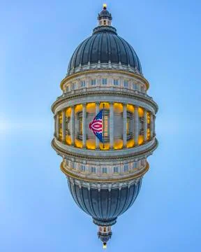 Vertical reflection capital building dome and flag Stock Photos