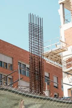 Vertical reinforcement welded structure on construction site, part of reinfor Stock Photos