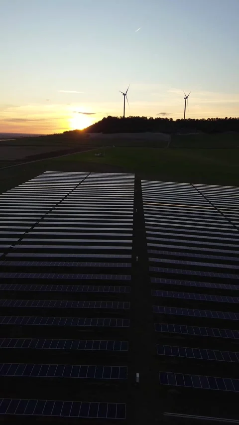 Vertical Renewable Energy Background with Solar Panels and Wind Turbines Stock Footage 330945613