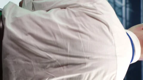 Vertical Repairman running code in data center Stock Footage 248420075