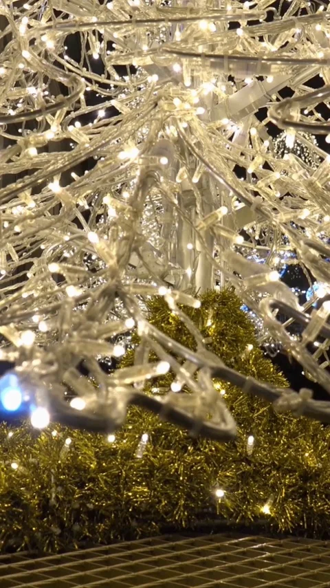 Vertical resolution shot artificial Christmas tree tilt up at Christmas market Stock Footage 116547083