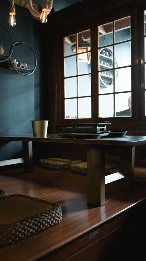 Vertical restaurant interior with wooden table and traditional Asian dining Stock Footage 333876289
