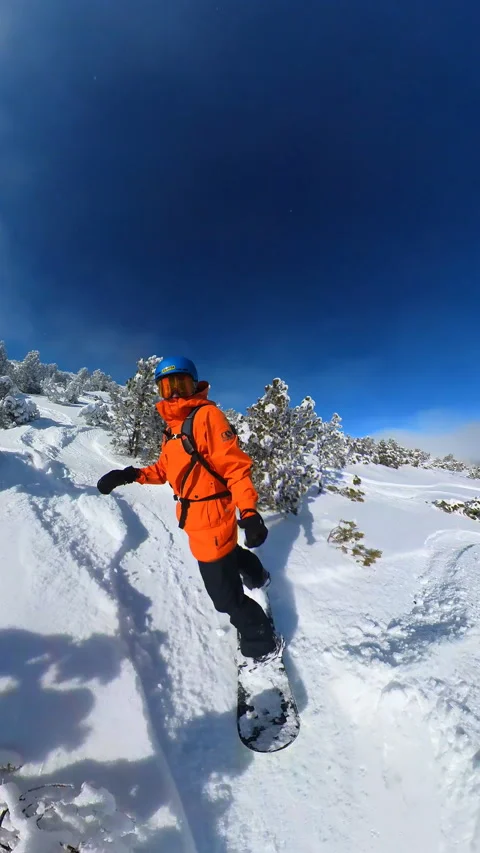 Vertical Rider's board slices through untouched powder snow Stock Footage 262552899