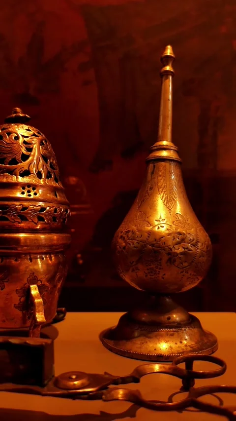 Vertical right-to-left pan of historical metal artifacts, focusing on the fine Video stock 334108591