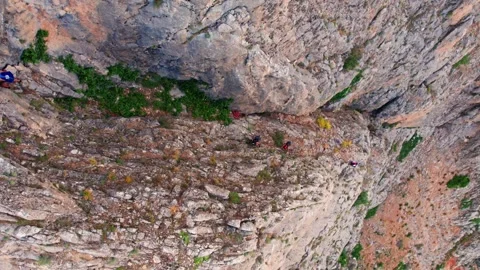 "Vertical Rock Ascent Before Wingsuit Dive" Stock Footage 309206042