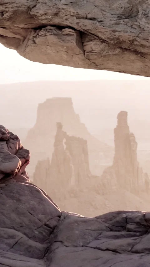 Vertical Rock Opening to Desert Landscape with Dust 4K Loop Video stock 274406930