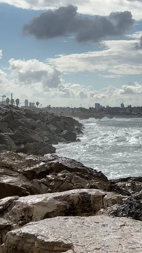 Vertical rocks and waves slow motion Stock Footage 257677015