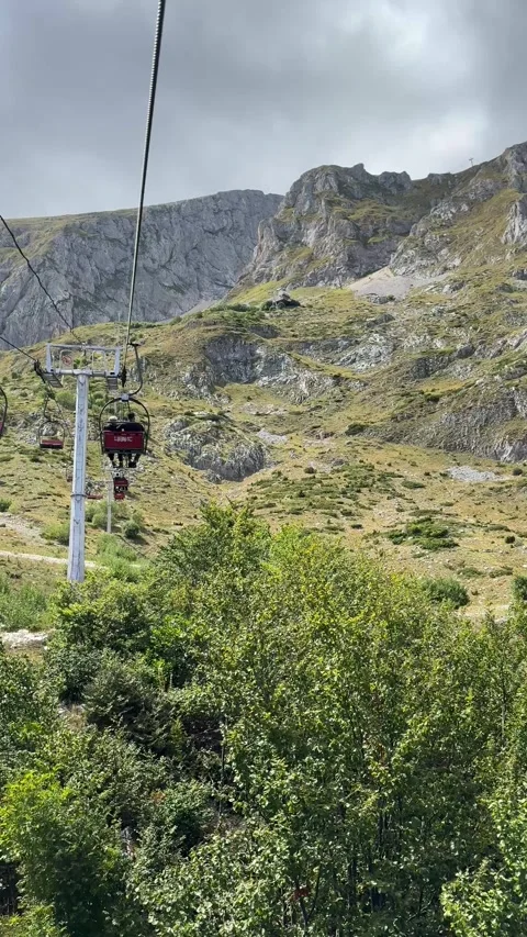 Vertical rocky cliffs and valley in Montenegro viewed from cable car Stock Footage 319442171