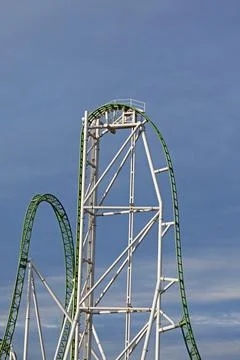 A vertical roller coaster with green tracks Stock Photos