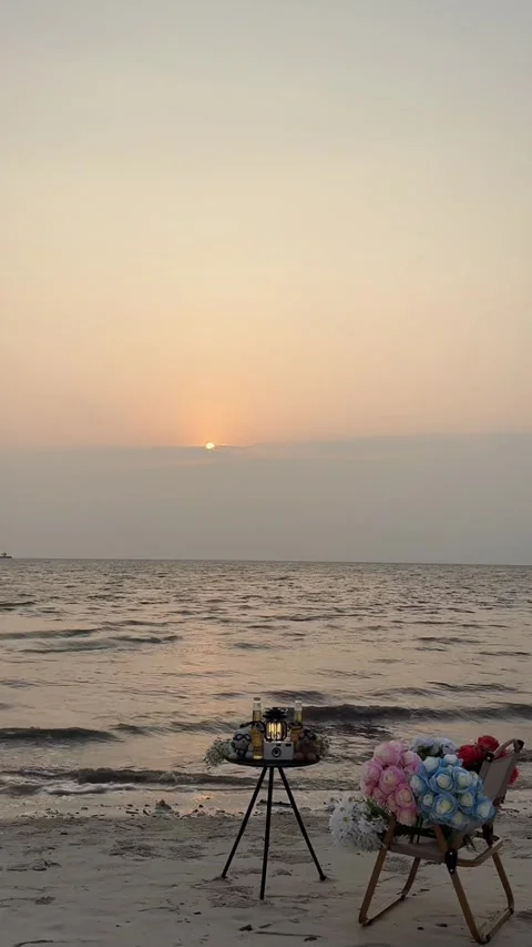 Vertical Romantic Beach Sunset Camping Table with Roses 動画素材 333488168